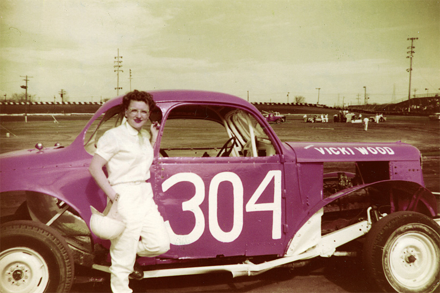 vicki wood poses with her stock car