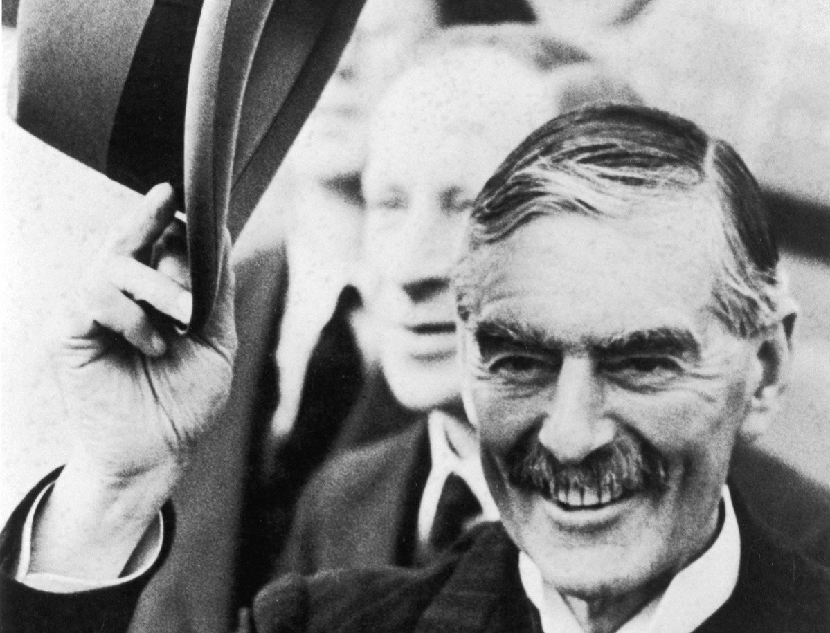 Prime Minister Neville Chamberlain (1869-1940) greeting crowds on return, 16 September 1938.