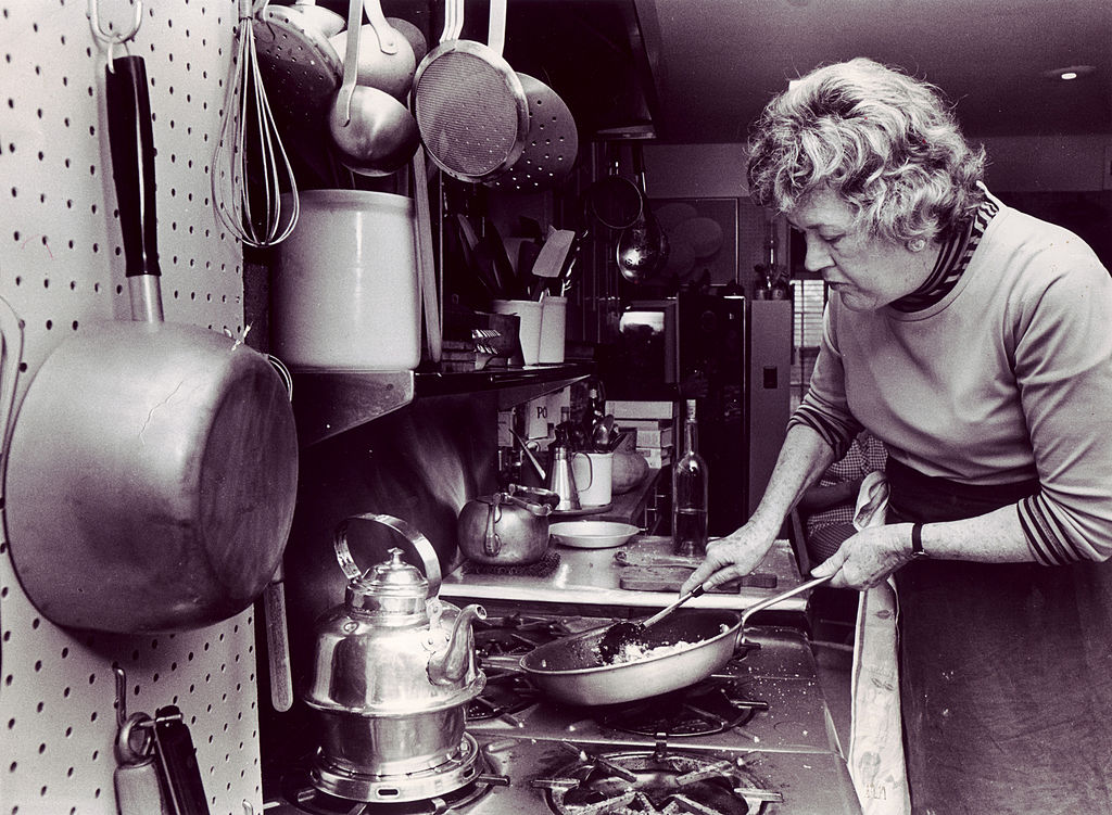 ulia Child prepares scallops in her kitchen in Cambridge