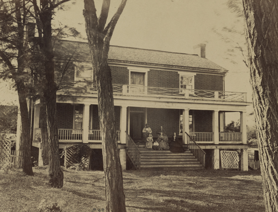 Wilmer McLean and his family sit on the porch of his house, where Confederate Gen. Robert E. Lee signed the terms of surrender to U.S. Gen. Ulysses S. Grant, in April, 1865