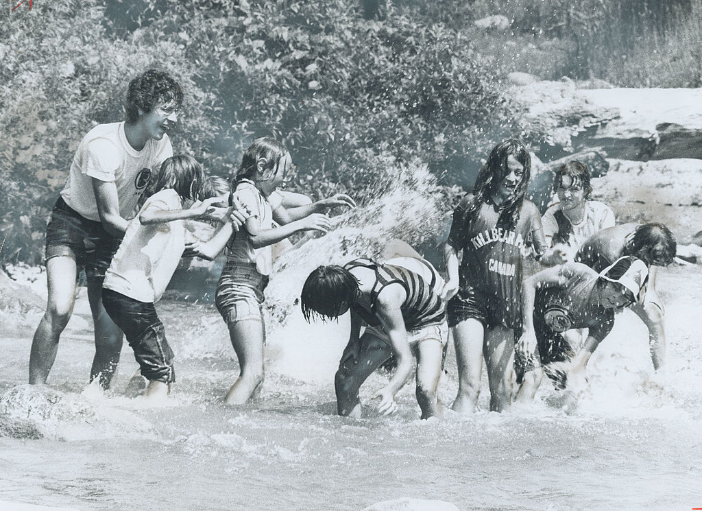 playing in the water at summer camp