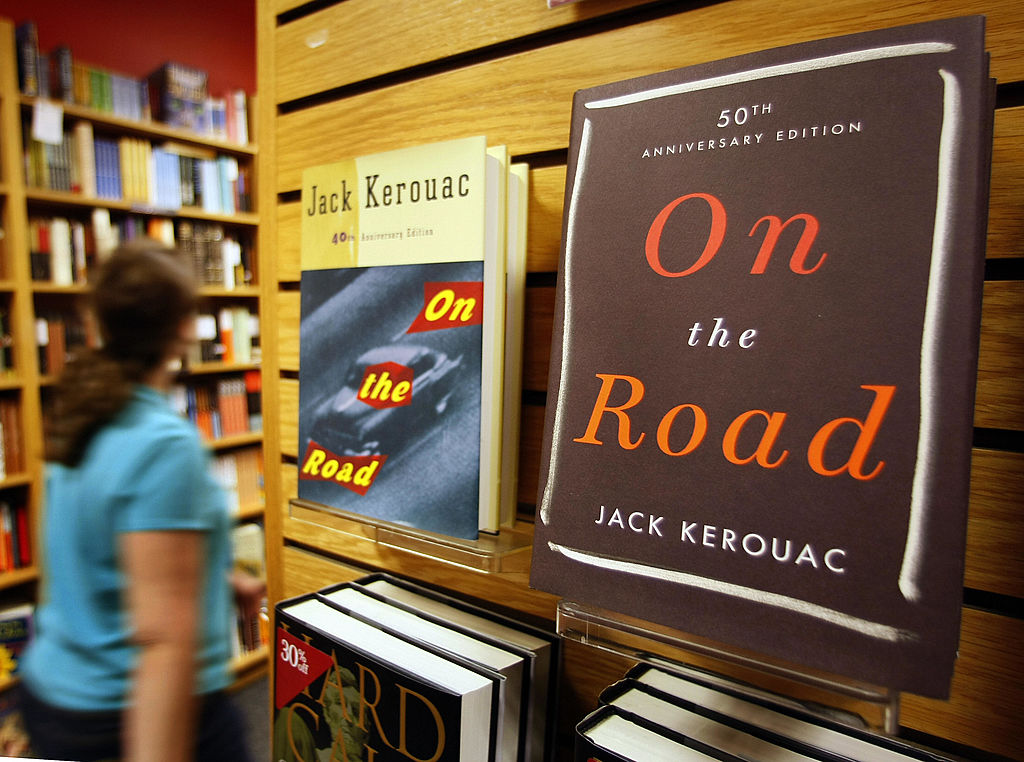 two copies of on the road displayed in a book store