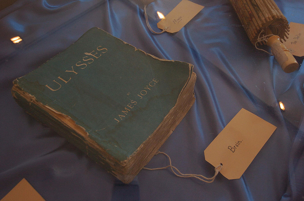 a worn down copy of ulysses on a tablecloth with a tag that says brain