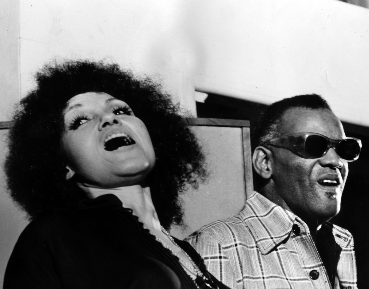 Ray sings along with a woman