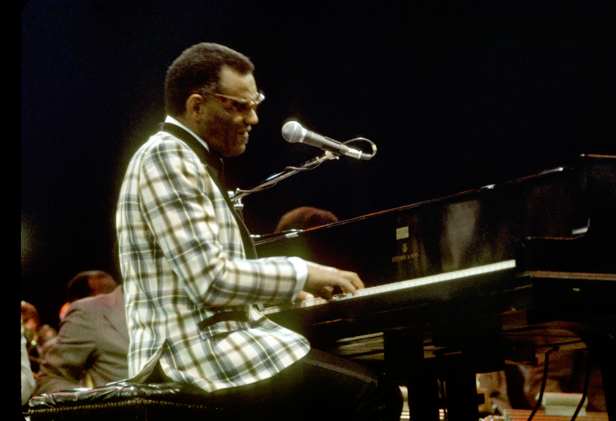 Ray Charles plays a piano