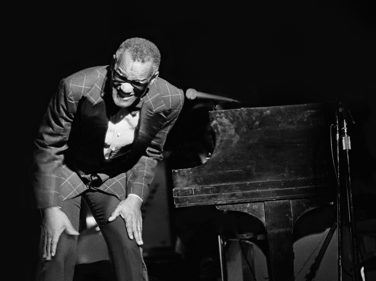 Ray Charles bows during a performance
