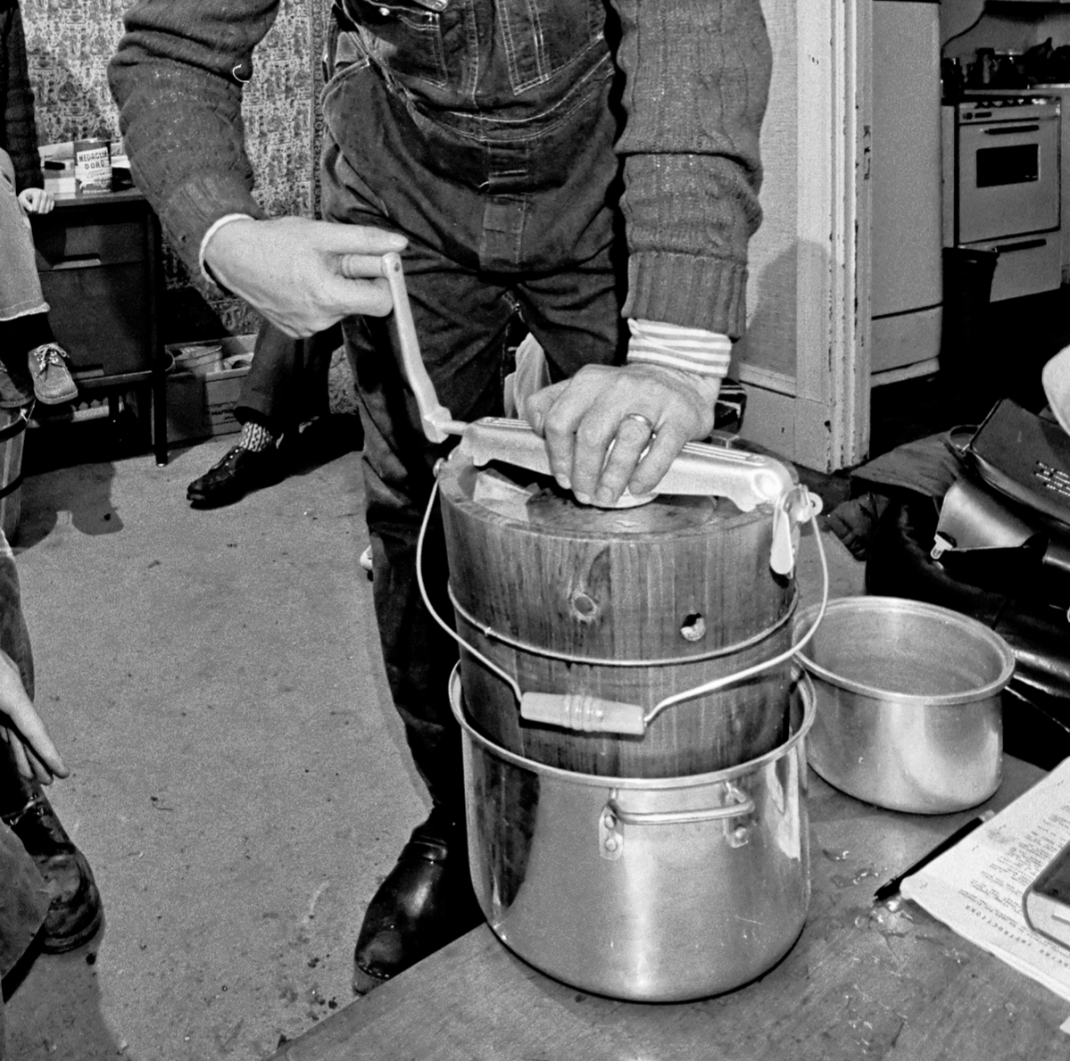 Tufts Roots and Growth House program director professor Jesper Rosenmeier uses an old-fashioned hand crank freezer to make 'academic ice cream,' Medford, Massachusetts, 1973.