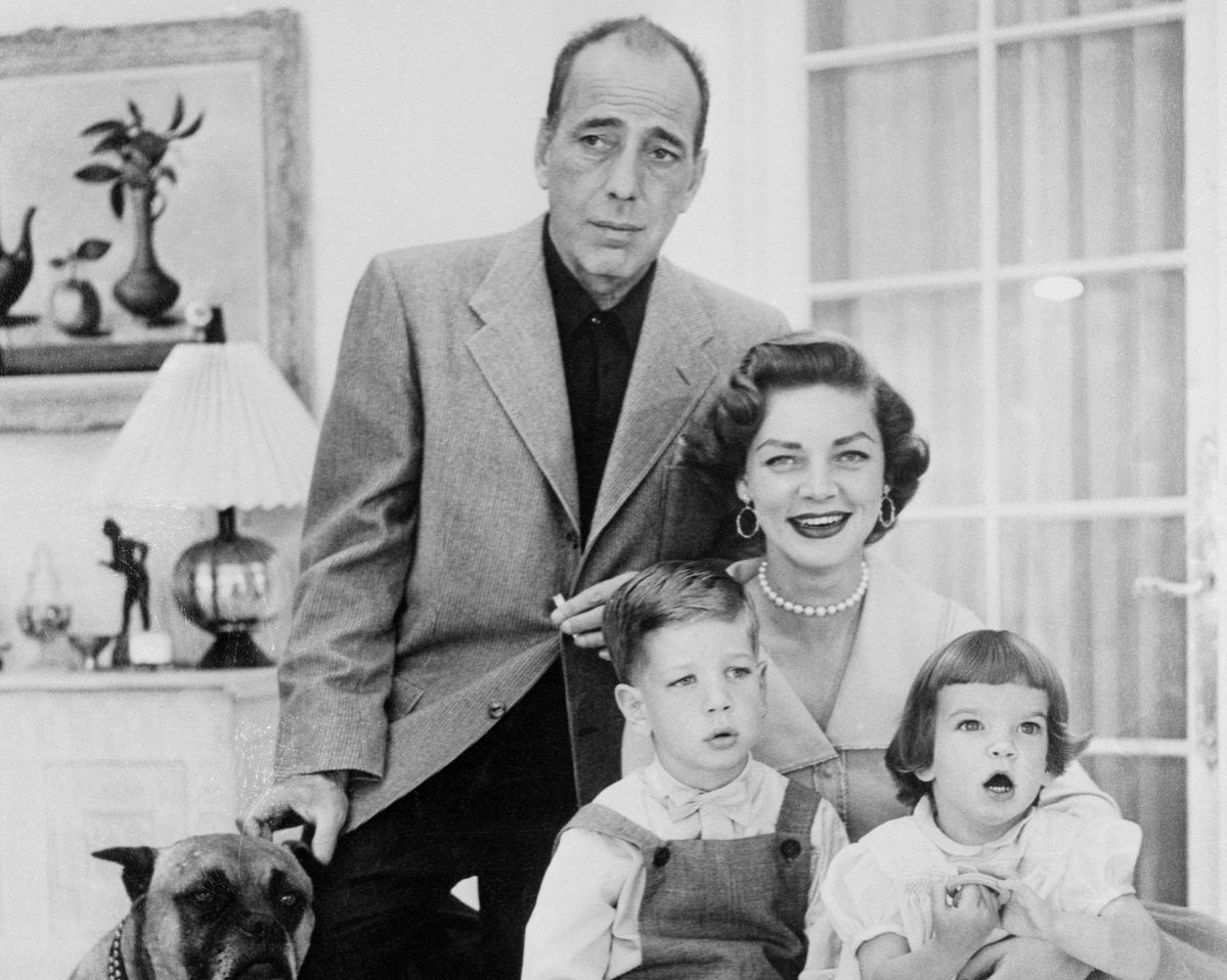 Humphrey Bogart and Lauren Bacall playing ball with son, Stephen, and daughter, Leslie.