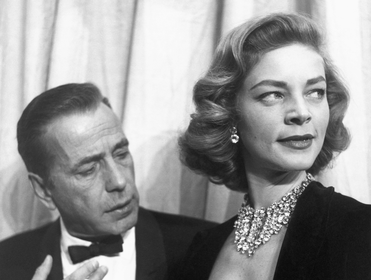 Actors Humphrey Bogart and Lauren Bacall attend the Academy Awards in 1955