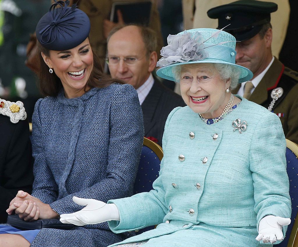 Catherine, Duchess of Cambridge and Queen Elizabeth II watch part of a children's sports event 