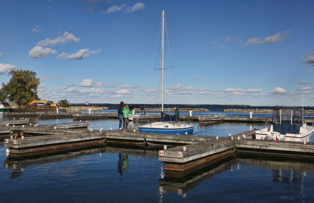 Two locals converse on the deck at Jackson Point harbor