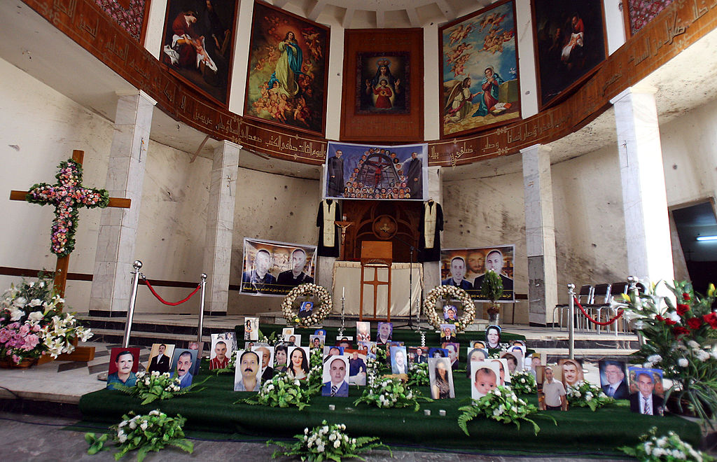 Photographs of victims are showcased on the church's alter.