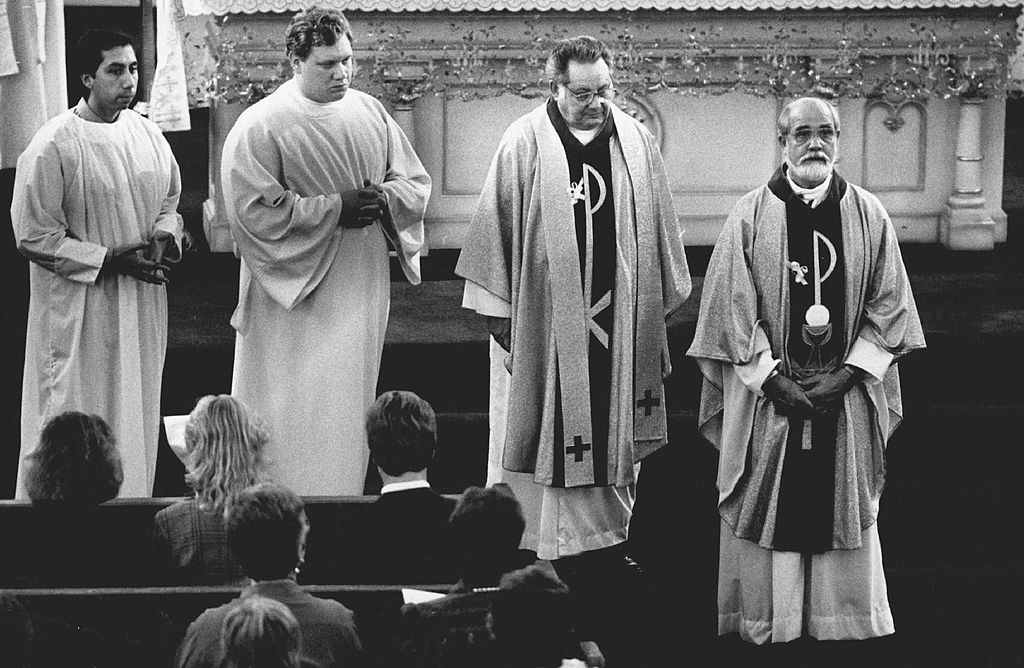Father Jenco looks up while standing in church, at mass, only 6 months after his release.