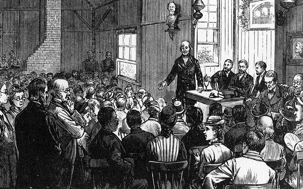 Amos is sketched lecturing in front of a large body of students and professors at Concord School of Philosophy