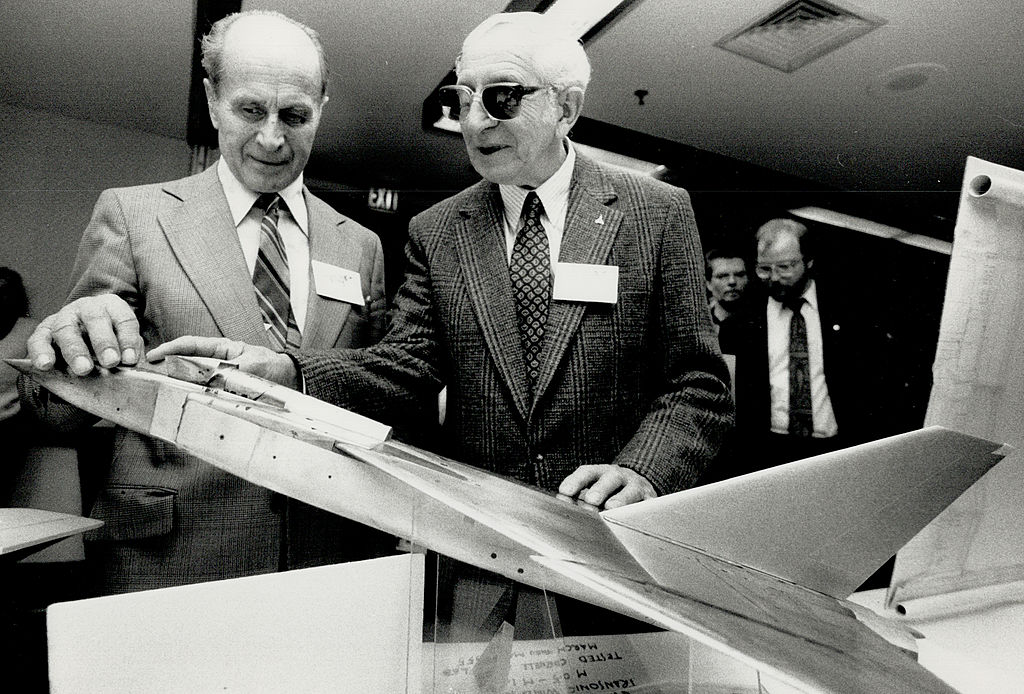 Canadian test pilots examine a small Avro Arrow model from which a prototype would be based.