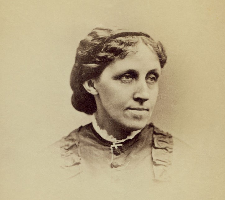 Louisa offers a small grin in this portrait from 1870.