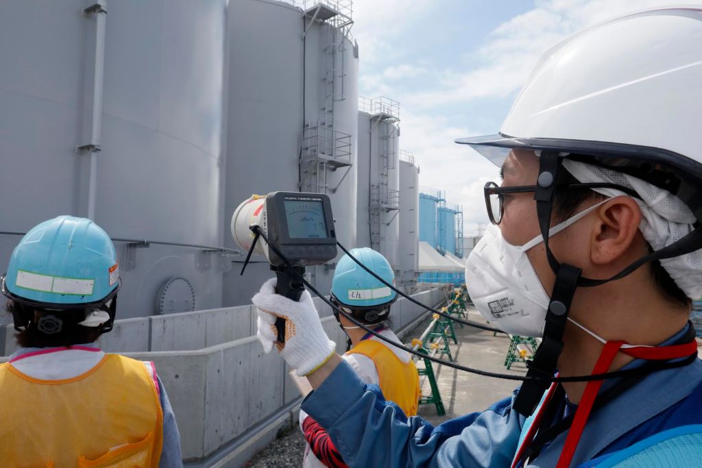 Workers with radiation gauge