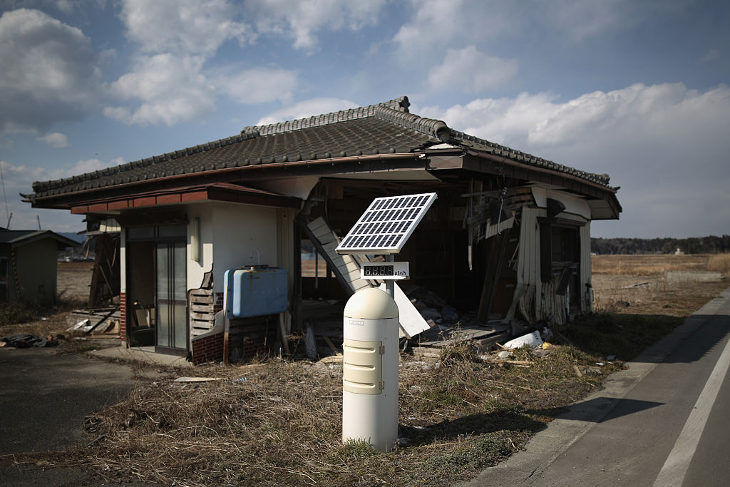 Station in front of abandoned house