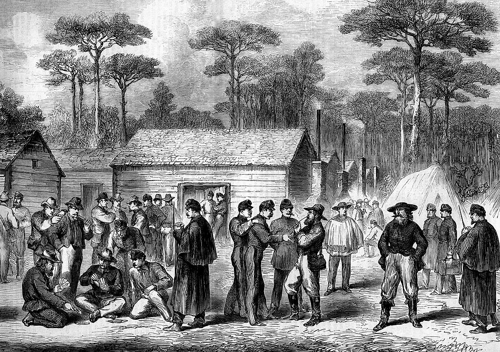 Men gather in a village.