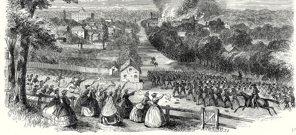 Women wave to soldiers in battle.
