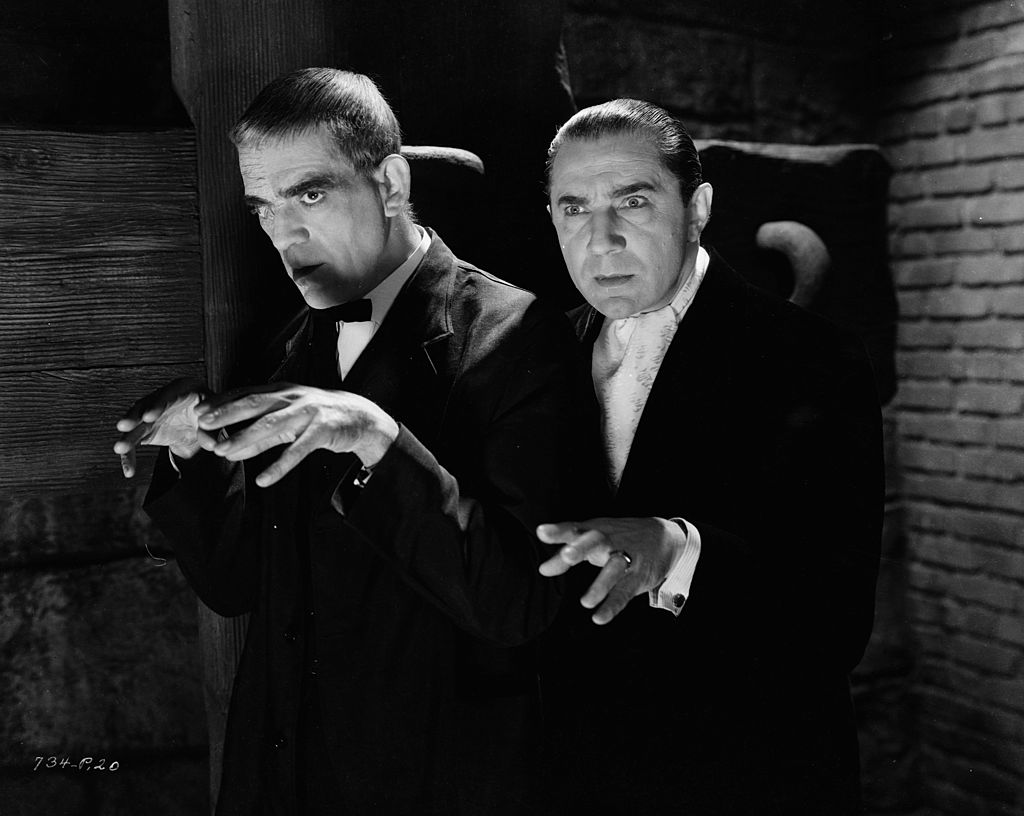 boris karloff posing for a picture with bela lugosi