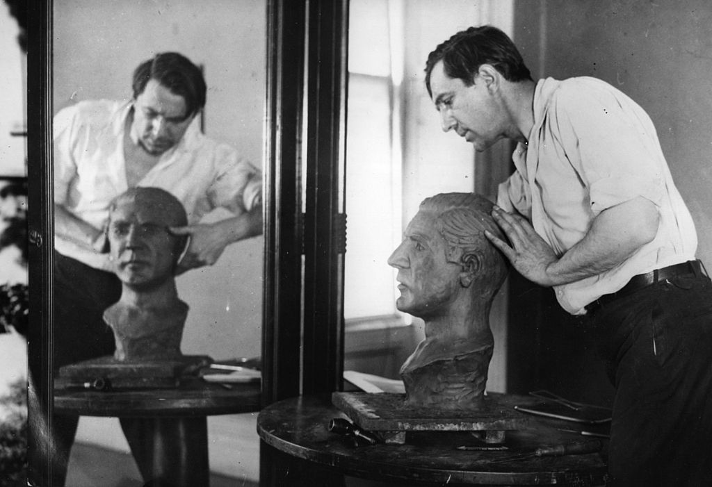 bela lugosi sculpting a bust of himself