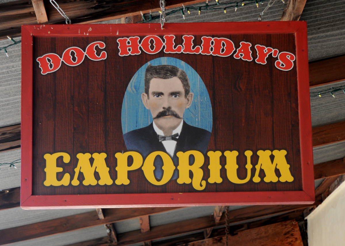 A sign hangs over the entrance to Doc Holliday's Emporium in historic Tombstone, Arizona, known as 'The Town Too Tough to Die.'