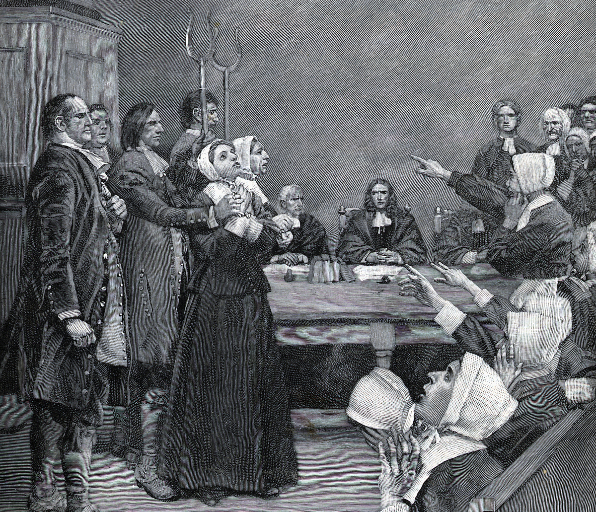 Engraving by Howard Pyle depicts the accusation of a bedeviled girl during the Salem witch trials.