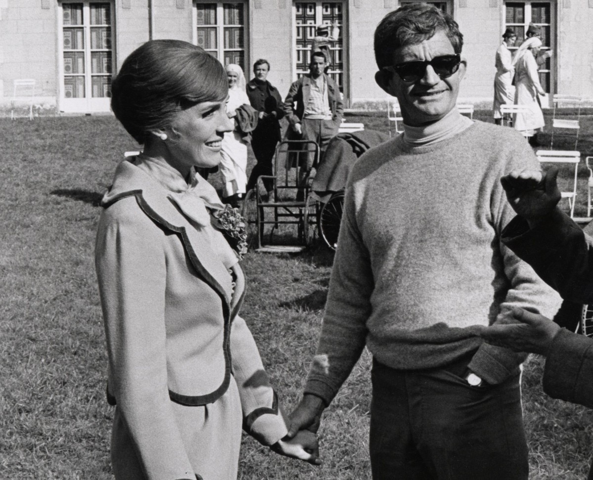Andrews and Edwards hold hands while on set.