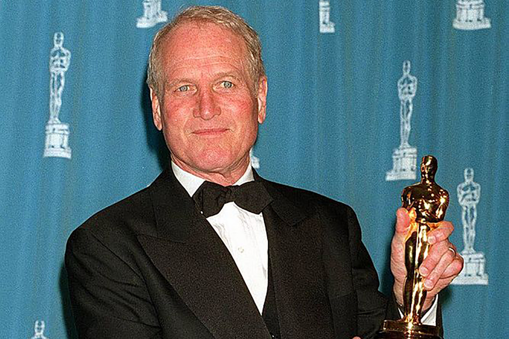 Newman holding an Oscar