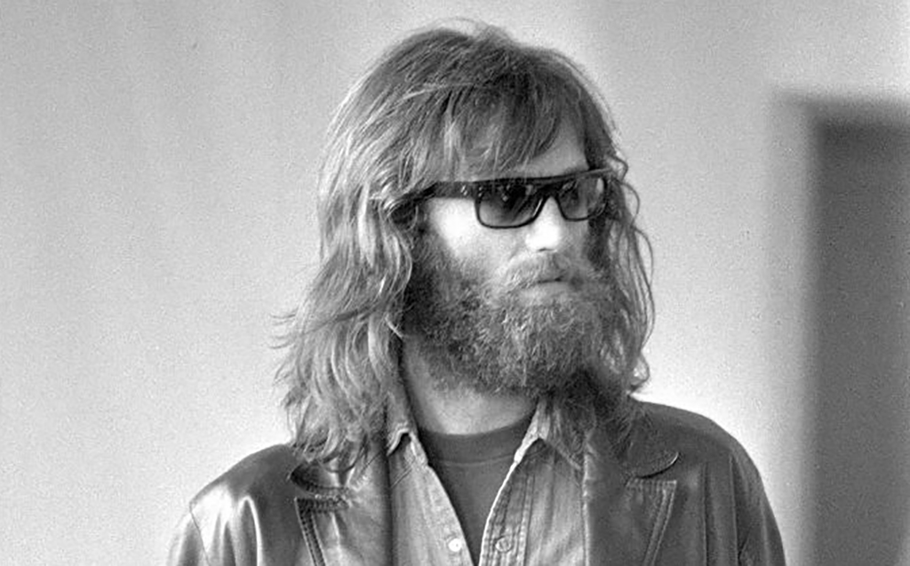 Peter Fonda with long hair and sunglasses