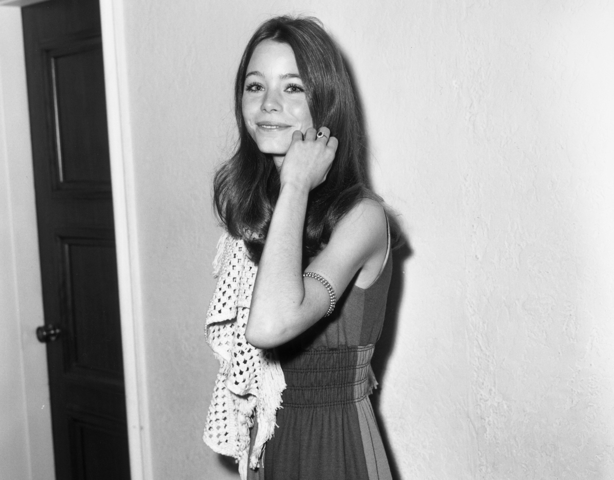 American actor Susan Dey touches her hair and smiles while at the annual Golden Apple Awards.