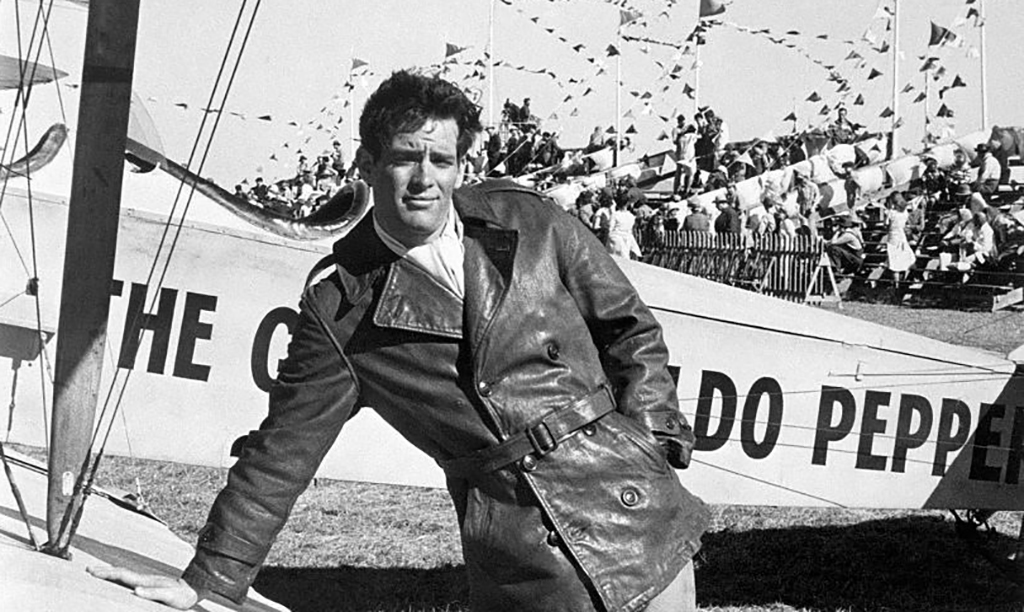 Scott Newman standing by an airplane