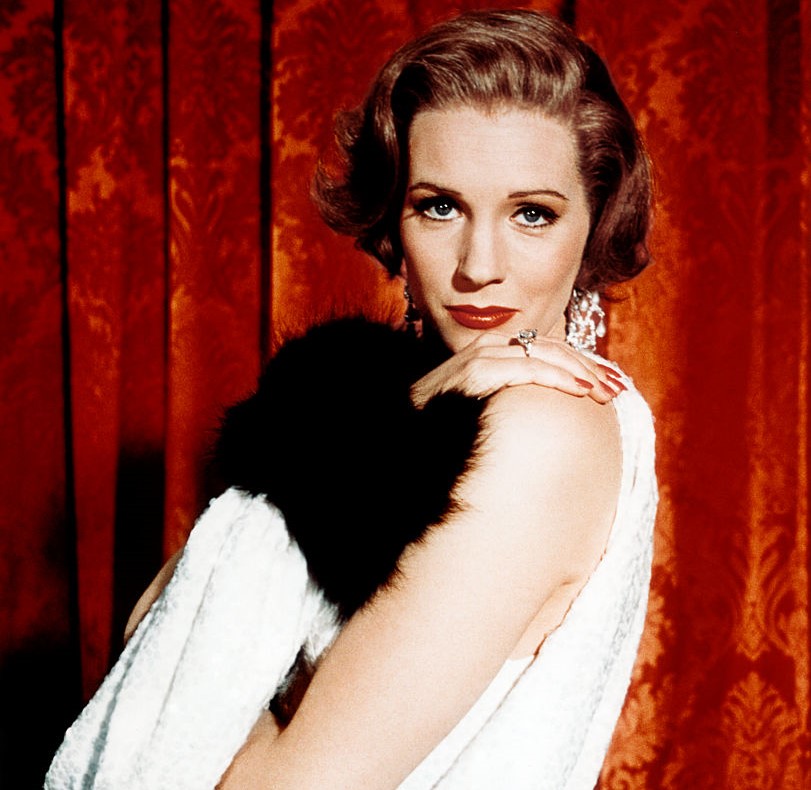 Julie Andrews poses while dressed like a flapper.