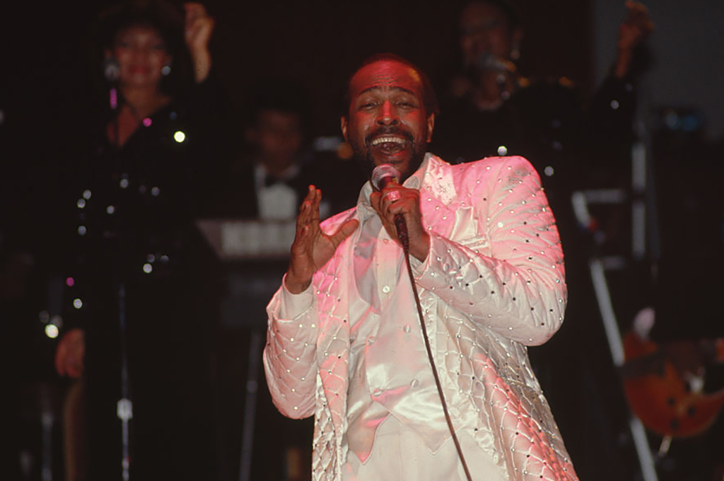 Marvin Gaye performing in an all white suit