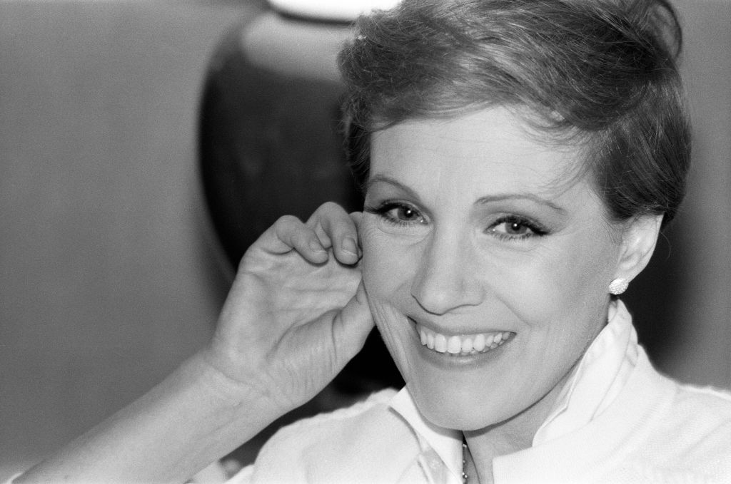 Julie smiles with a hand to her cheek in 1981.