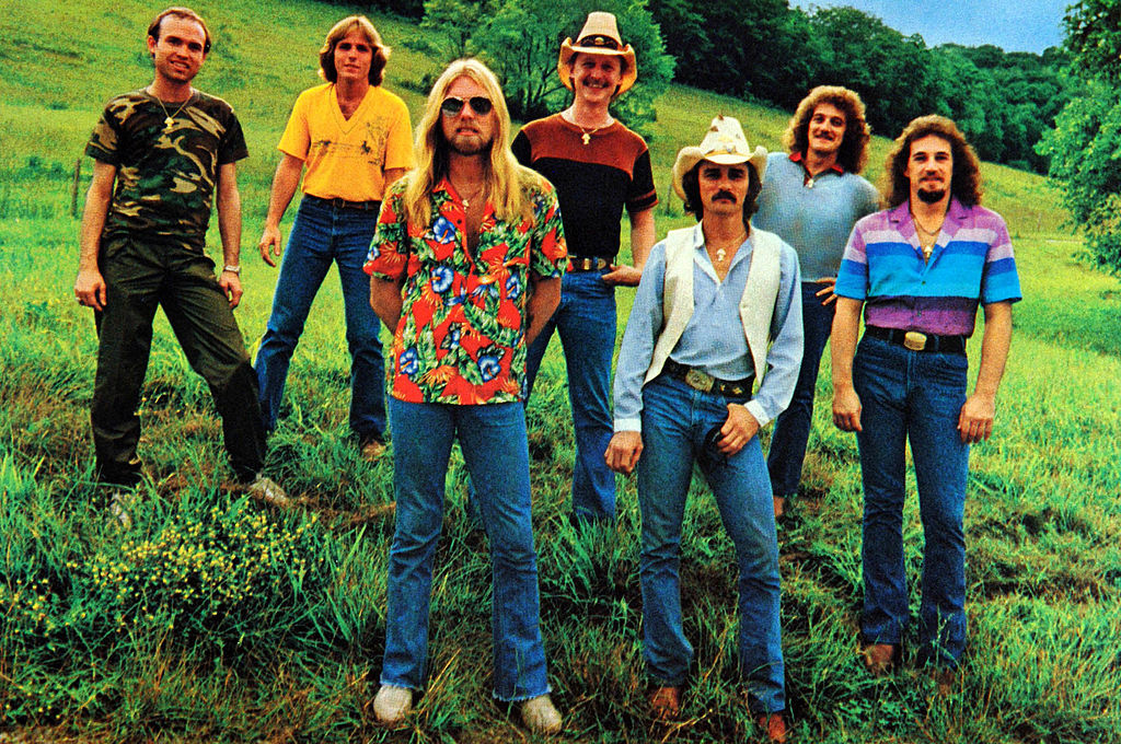 The Allman Brothers Band standing in a field