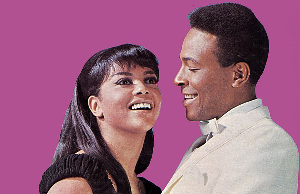 Tammi and Marvin in front of a pink background