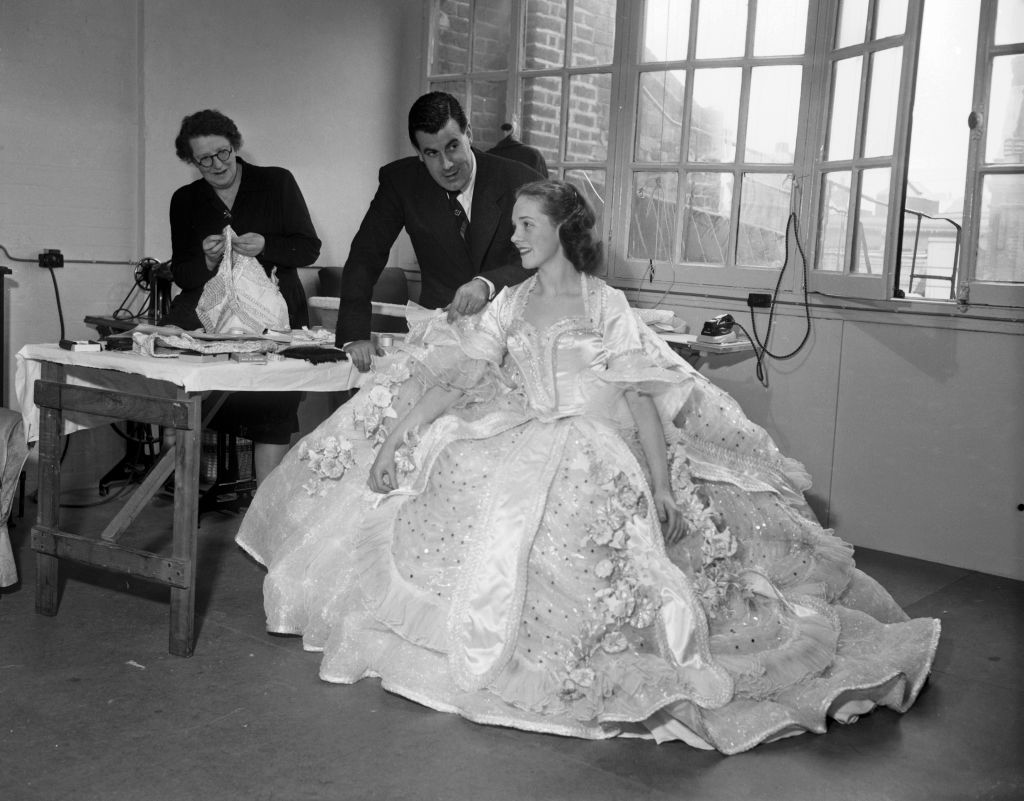 Teenage Julie sits in a large gown made for her role as Cinderella.