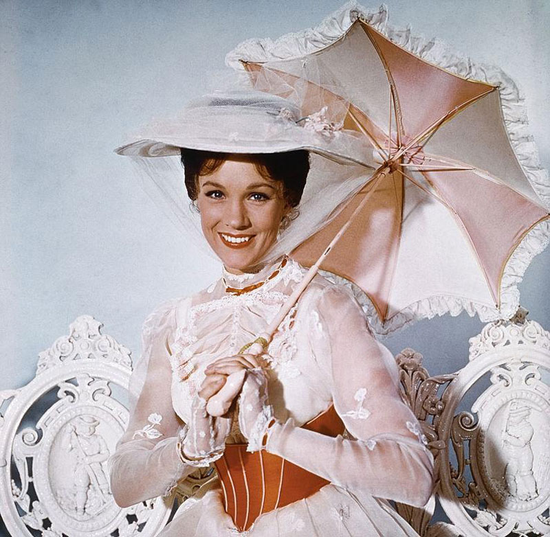 Julie Andrews poses with an umbrella as Mary Poppins.