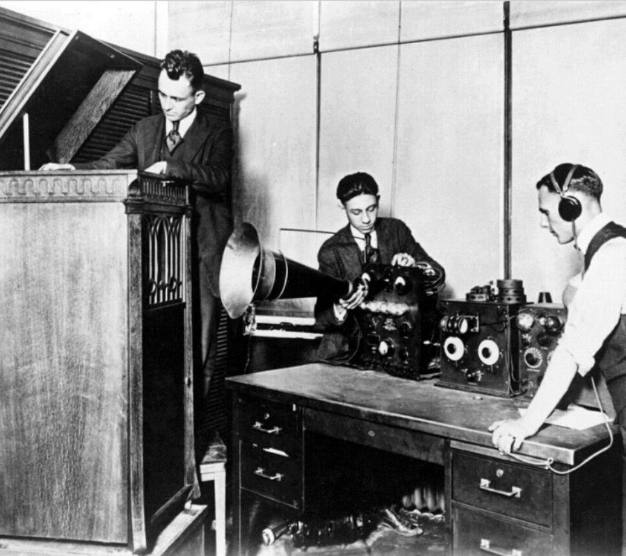 a radio station getting ready for a broadcast in the 1920s