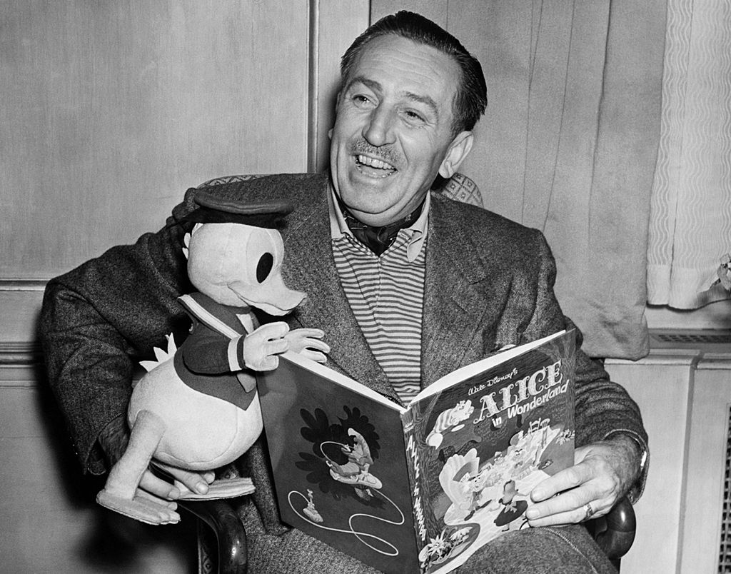 Film producer and cartoonist Walt Disney with a toy Donald Duck