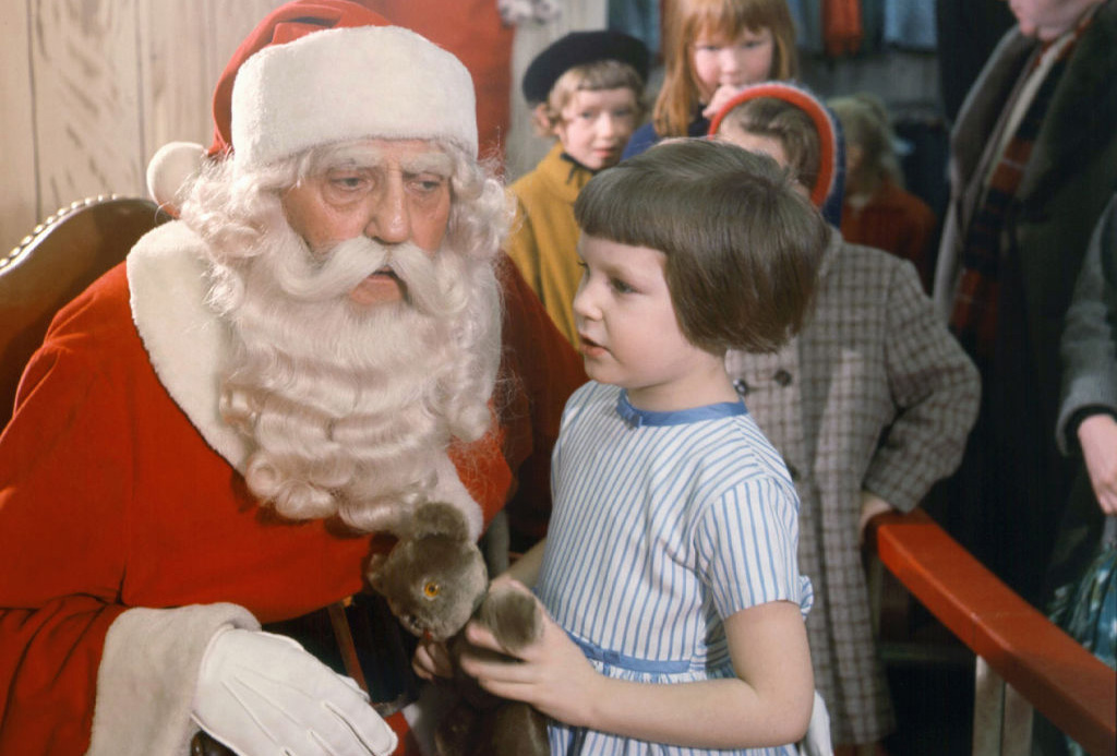 Little girl talking to Santa 