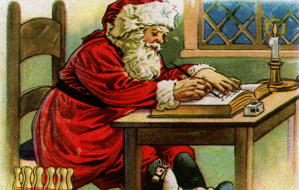 Santa writing in his book 