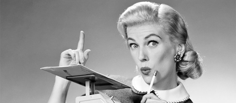 a woman weighing mail on postage scale