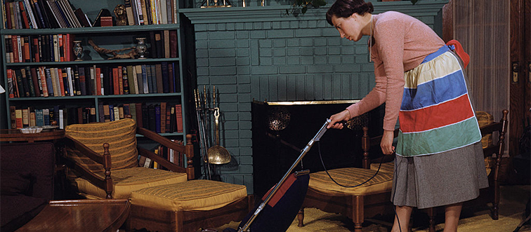 a woman vacuuming a living room