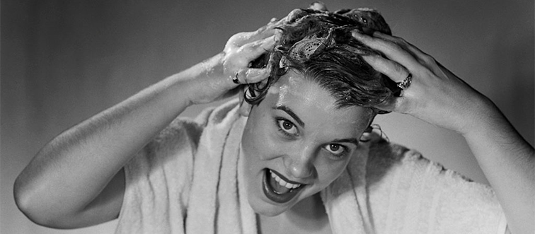 a woman washing her hair