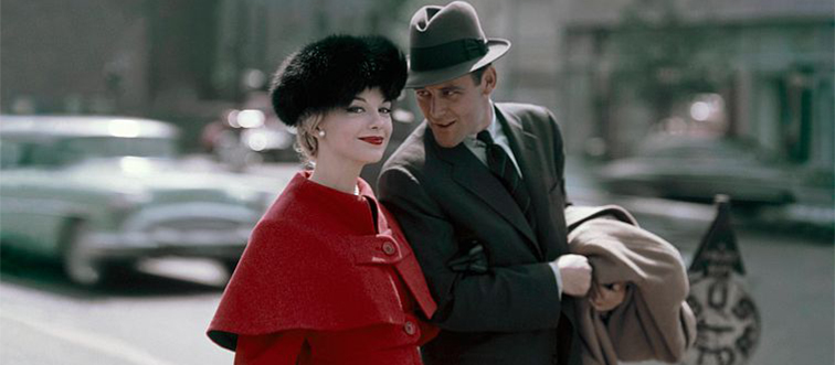 woman and man walking in the street