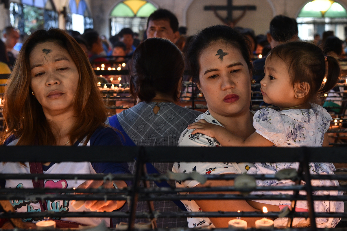 Catholics pray during Lent at a church.