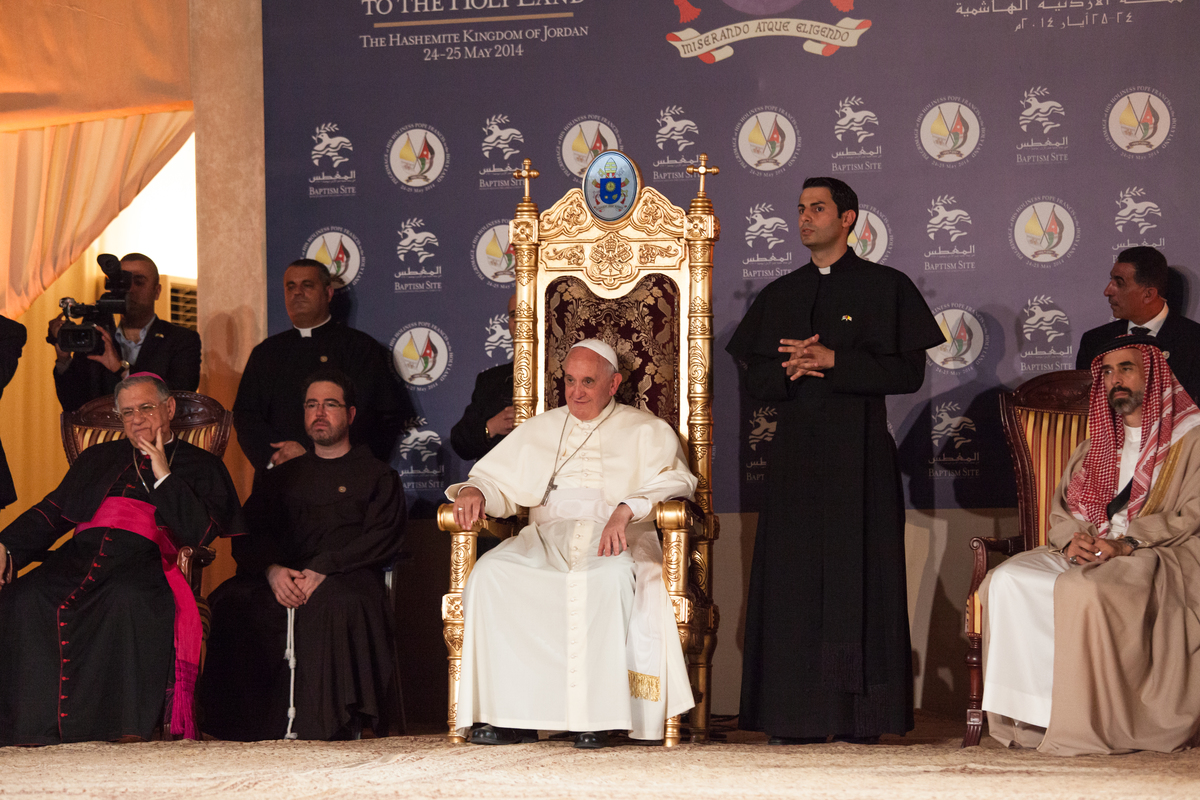Pope Francis meets a young Syrian refugee in the newly built catholic church on the banks of the River Jordan.